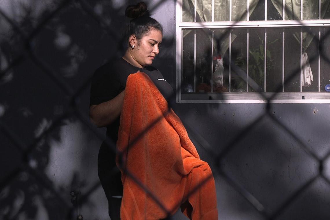 Ledys Cuevas brings a towel for her son Danny Alvarado, 5, at her home in Miami, on Wednesday, March 18, 2020.