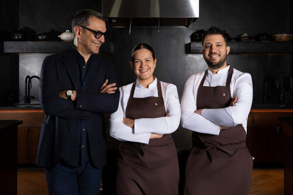 Alvaro Perez Miranda with husband-and-wife chefs Osmel Gonzalez and Camila Salazar at Emelina, their Cuban restaurant in West Palm Beach. Emelina was just awarded a Michelin star.