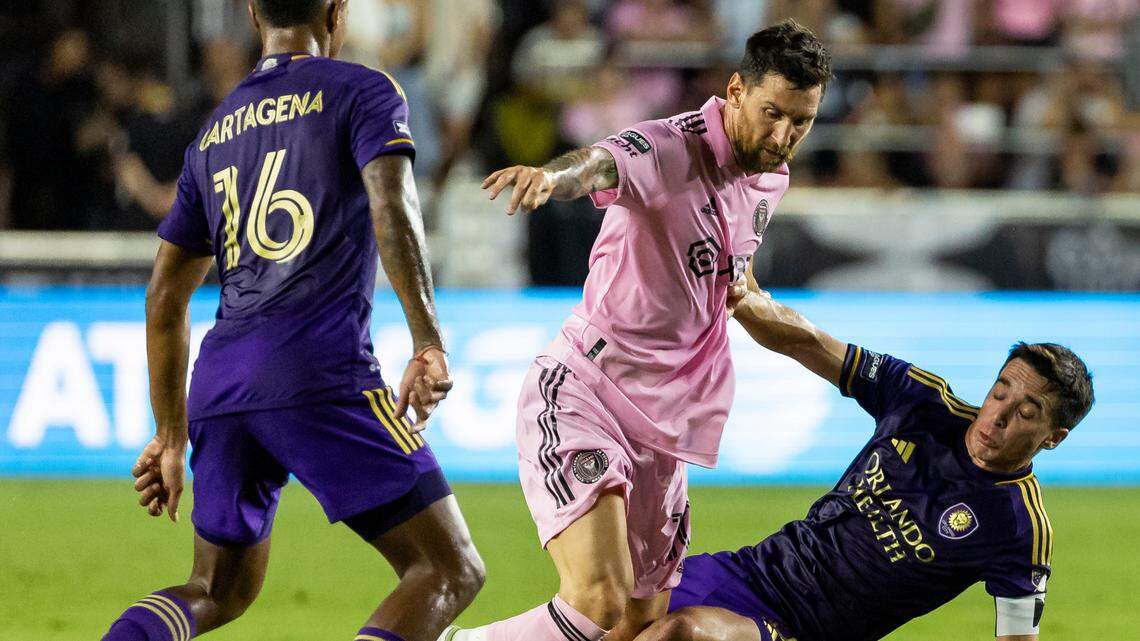 Inter Miami forward Lionel Messi (10) and Orlando City midfielder Felipe Martins (8) fight for possession of the ball in the first half of a Leagues Cup Round of 32 match at DRV PNK Stadium on Wednesday, Aug. 2, 2023, in Fort Lauderdale, Fla.