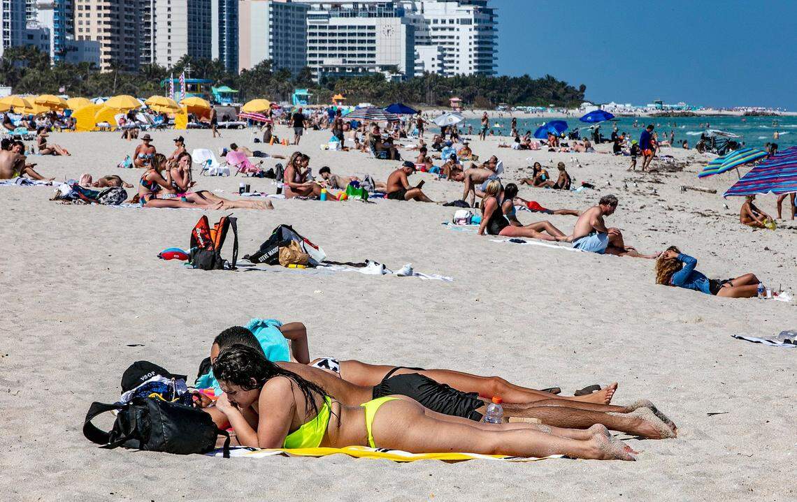 Beach goers enjoy South Beach on March 2, 2021. One year after Miami Beach shut down spring break, the tourists are back and hotels are at 70% occupancy.