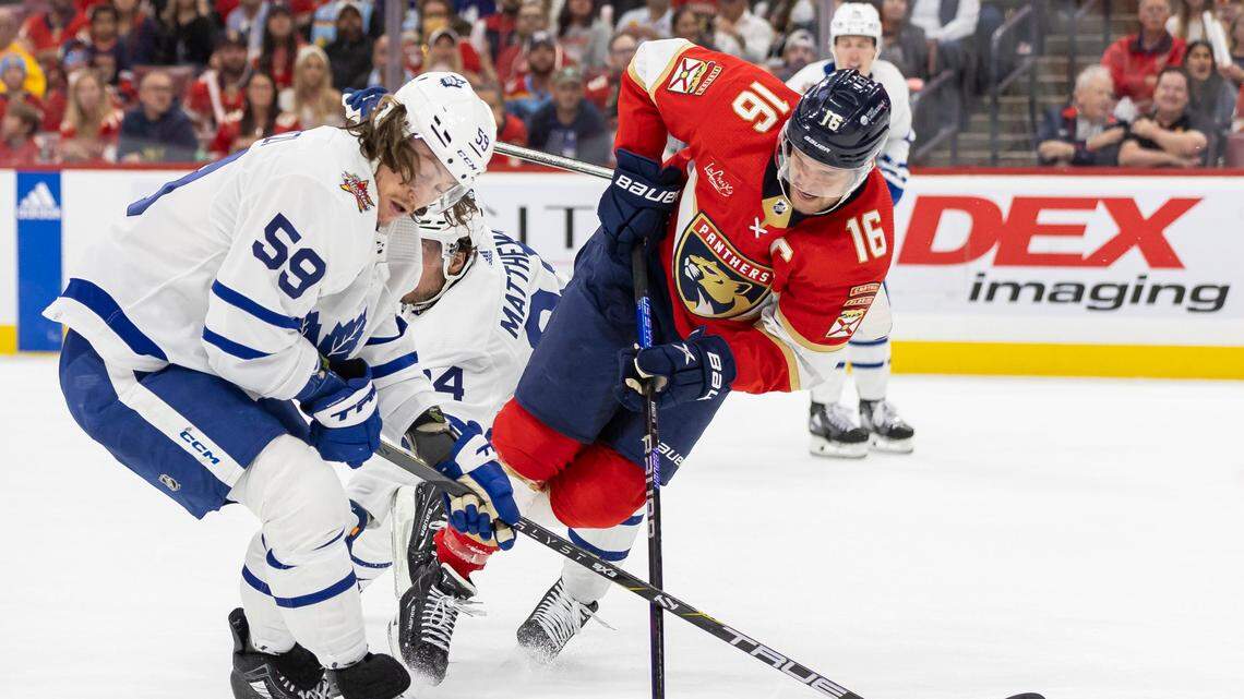 Toronto Maple Leafs left wing Tyler Bertuzzi (59) trips Florida Panthers center Aleksander Barkov (16) in the first period of their NHL game at the Amerant Bank Arena on Thursday, Oct. 19, 2023, in Sunrise, Fla.