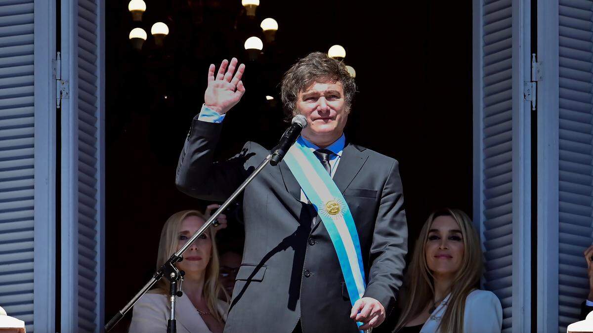 (231212) -- BEIJING, Dec. 12, 2023 (Xinhua) -- Argentina’s new President Javier Milei waves to the crowd from the balcony of the Casa Rosada Presidential Palace in Buenos Aires, Argentina, Dec. 10, 2023. Javier Milei, a liberal politician and economist, assumed the Argentine presidency Sunday in a ceremony held at the National Congress in Buenos Aires, the country’s capital. The outgoing head of state, Alberto Fernandez, placed the presidential sash and handed the baton of command to Milei, whose term will last for four years, until Dec. 10, 2027. (Photo by German Adrasti/Xinhua) (Photo by Xinhua/Sipa USA)
