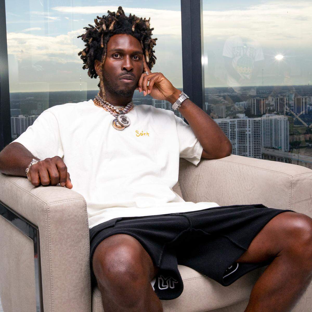 Carlos St. John Phillips, known professionally as SAINt JHN, a Guyanese-American rapper, singer and songwriter sits in his living room/recording studio at his home in Sunny Isles Beach, Florida, on Monday, August 2, 2021.