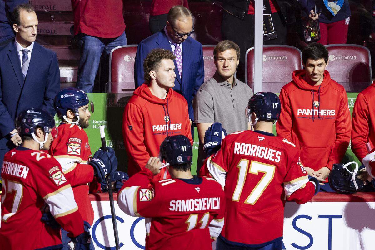 Florida Panthers center Aleksander Barkov (16) and Matthew Tkachuk (19) attend banner ceremony before their NHL home opener against the Chicago Blackhawks at the Amerant Bank Arena on Oct. 7, 2025 in Sunrise, Fla.