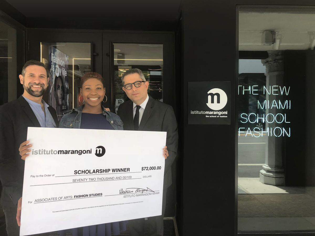 Destiny Charles, center, of Design and Architecture Senior High School has been awarded the $72,000 Istituto Marangoni Scholarship for her excellence in art, design, and academics. She is pictured with Massimo Casagrande, director of education at Istituto Marangoni, left; and Pablo Arbalaez, school director of Istituto Marangoni.