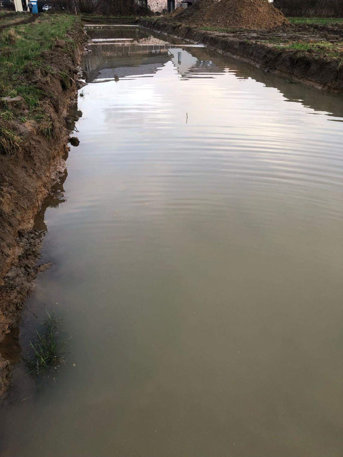 Bad weather caused the researchers to stall excavations and pump out the pits.