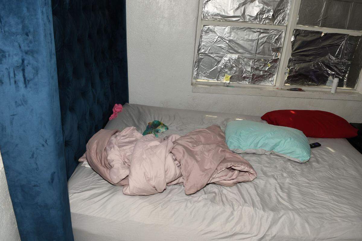 Crude window treatments at the home of Jabora Deris and Christoper Bryant, where their son Rashid died violently.