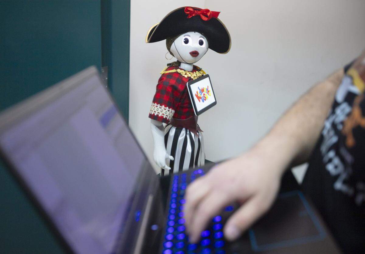 Kevin Soto adjusts Captain Pepper, an interactive educational AI, during an introduction at KidWorks USA in Hialeah, Fla., Monday, Feb. 2, 2026.