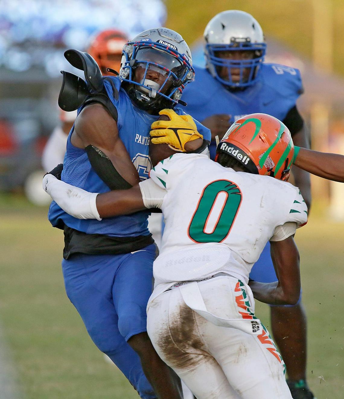 Dillard Panthers running back Christopher Johnson (6) tries to break free during football game against Blanche Ely Tigers on Saturday, November 5, 2022 at Dillard HS in Fort Lauderdale. Andrew Uloza / for Miami Herald