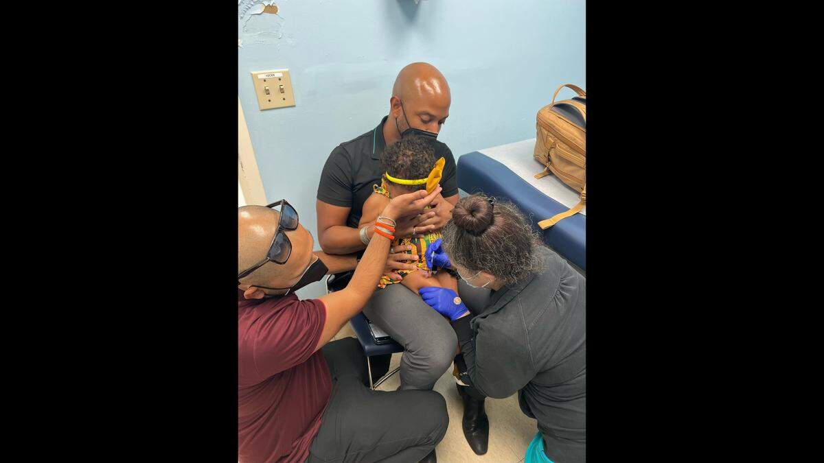 Paula, the 20-month-old daughter of Dr. Hansel Tookes and Peter Ortega, gets her first dose of Moderna’s COVID-19 pediatric vaccine for kids under 5 at Jessie Trice Community Health System on Wednesday, June 22, 2022