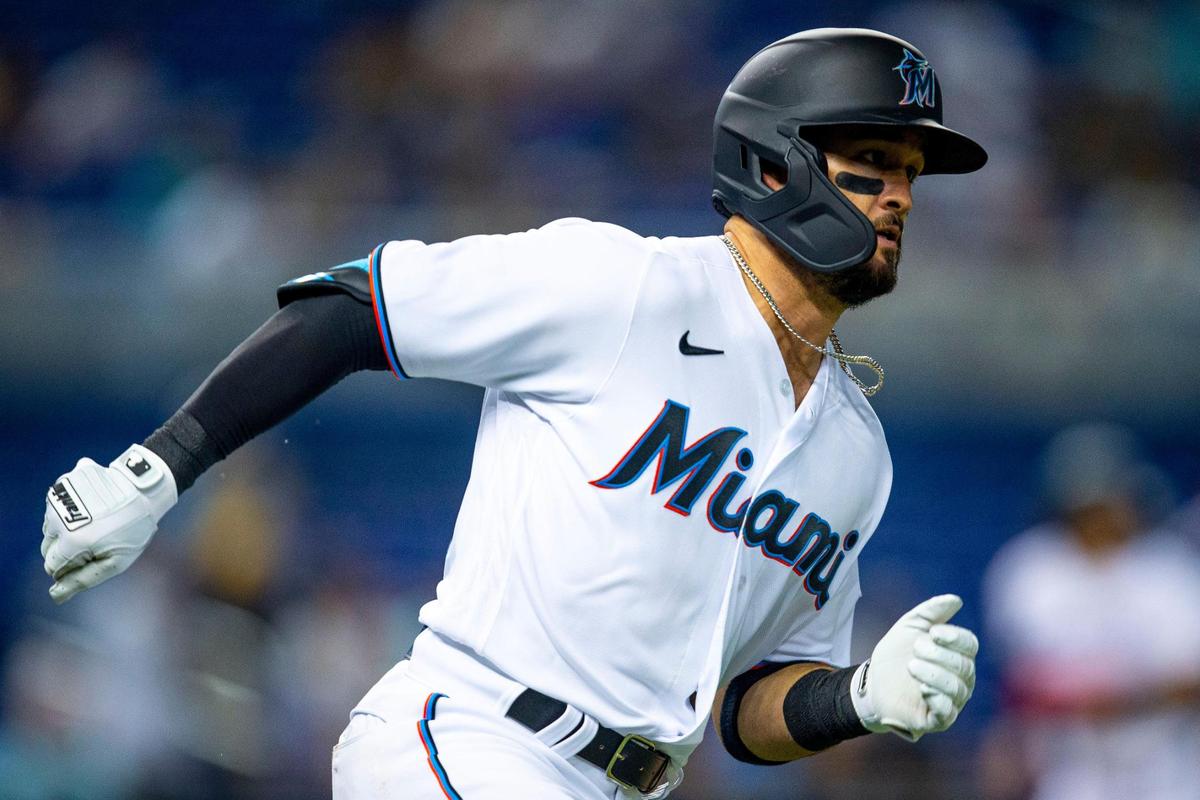 Miami Marlins player Eddy Alvarez (65) sprints to first base after hitting a line drive during the third inning of an MLB game against the New York Mets at loanDepot park in the Little Havana neighborhood of Miami, Florida, on Tuesday, September 7, 2021.