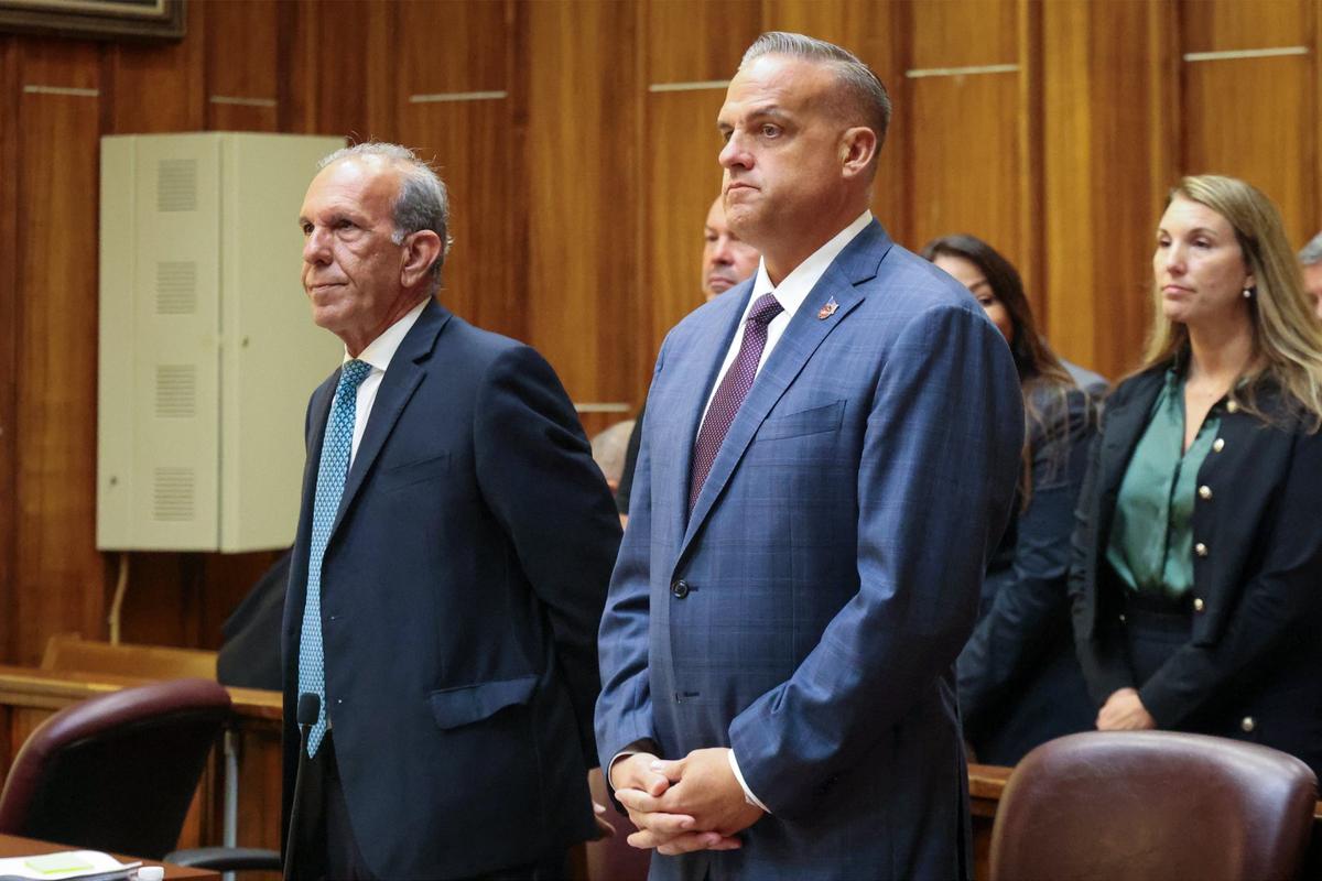 Frank Artiles, right, stands with his attorney Frank Quintero, left, and with friends and family sitting behind him during closing arguments inside Courtroom 4-1 at the Richard E. Gerstein Justice Building on Monday, September 30, 2024, in Miami, Florida.