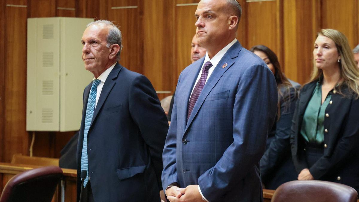 Frank Artiles, right, stands with his attorney Frank Quintero, left, and with friends and family sitting behind him during closing arguments inside Courtroom 4-1 at the Richard E. Gerstein Justice Building on Monday, September 30, 2024, in Miami, Florida.