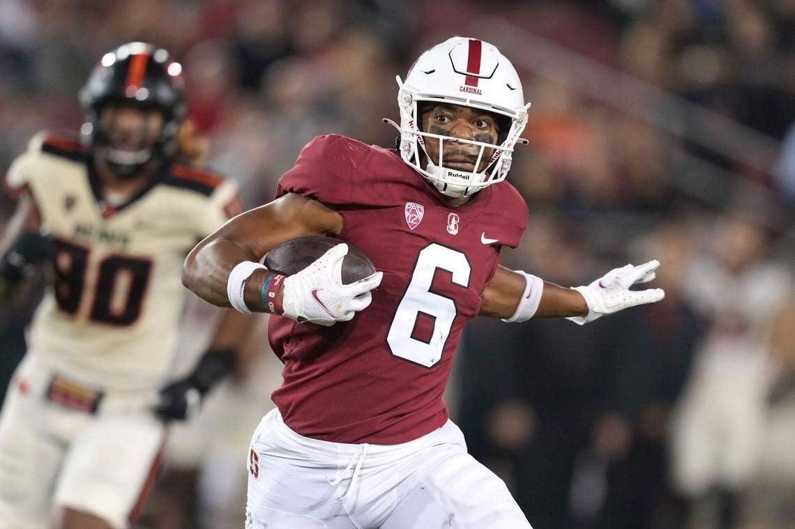 Oct 8, 2022; Stanford, California, USA; Stanford Cardinal wide receiver Elijah Higgins (6) carries the ball against the Oregon State Beavers during the second quarter at Stanford Stadium. Mandatory Credit: Darren Yamashita-USA TODAY Sports