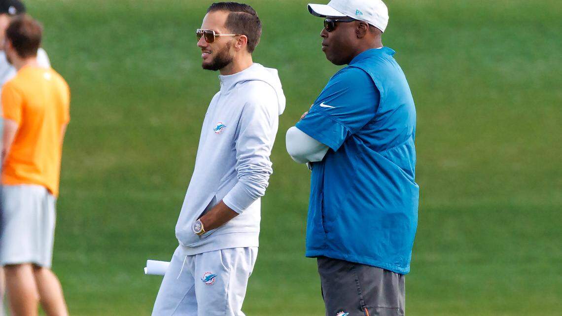 Miami Dolphins head coach Mike McDaniel and Dolphins general manager Chris Grier look the practice at Baptist Health Training Complex in Hard Rock Stadium on Wednesday, December 28, 2022 in Miami Gardens, Florida.