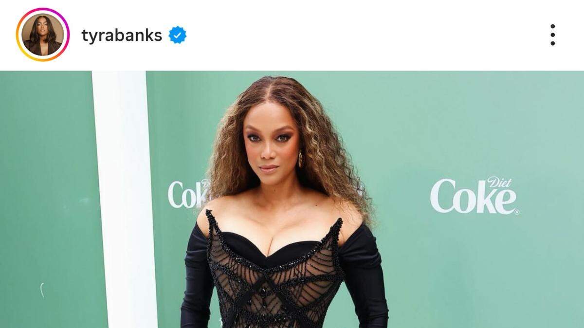 tyra banks wearing black dress