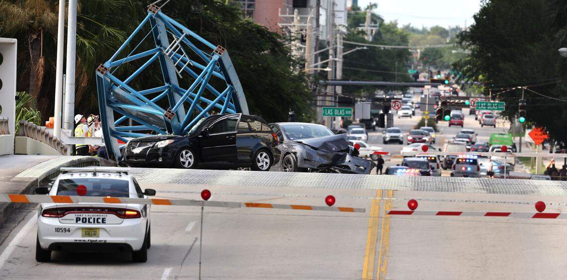 A construction worker was killed and two people were taken to the hospital after a portion of a crane dropped onto the Southeast Third Avenue bridge over the New River in downtown Fort Lauderdale on Thursday afternoon, April 4, 2024. (Carline Jean/South Florida Sun Sentinel)