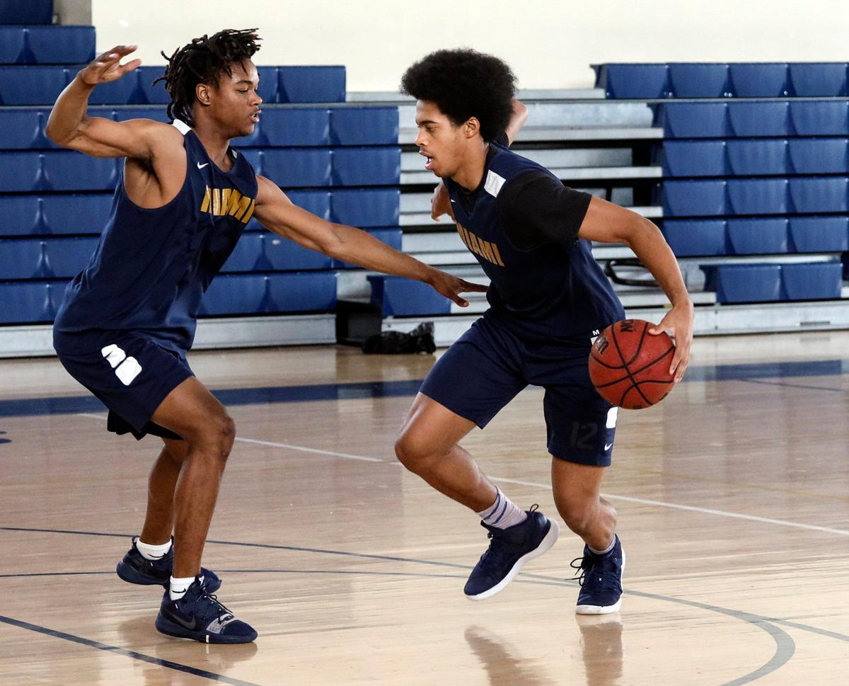Justin Neely, right, broke the Miami High all-time single-game record with a 60-point game.