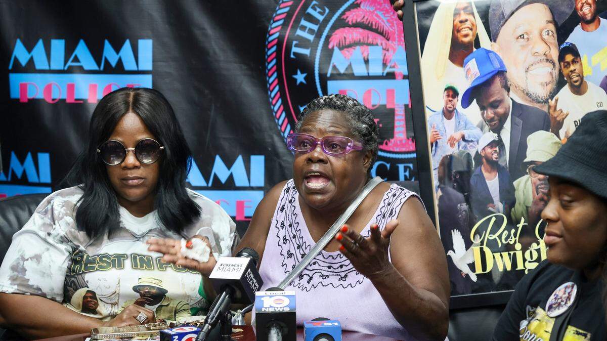 Sister Trawonna Barron, left, and niece Jokera Jordan, right, listen as Mary Brown, Dwight Wells’ mother, pleads for public help in solving the murder of her son.

Dwight Wells' family members pleaded for help in finding those responsible for his murder last October, 2025, due to multiple gunshot wounds during a press conference at Miami Police Department Headquarters on Thursday, December 18, 2025, in Miami, Florida.


