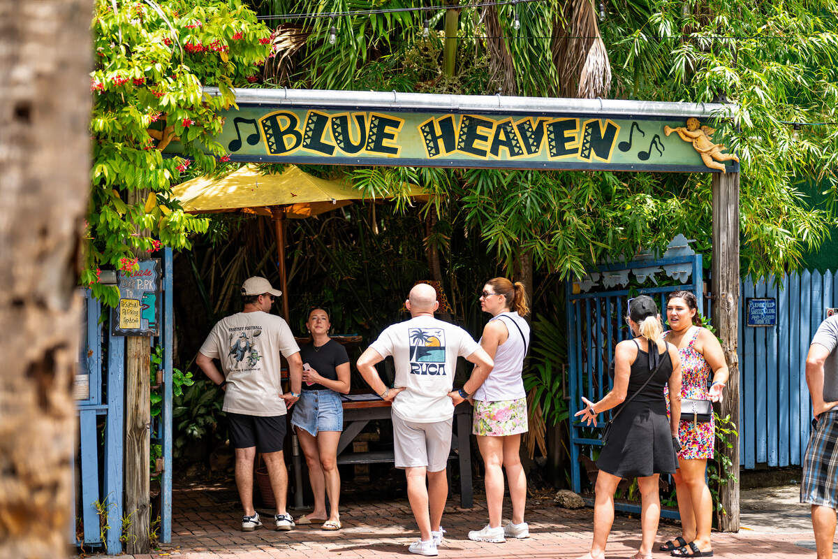Diners wait in line at the popular Key West restaurant Blue Heaven, which was recognized in the 2026 Michelin Guide.