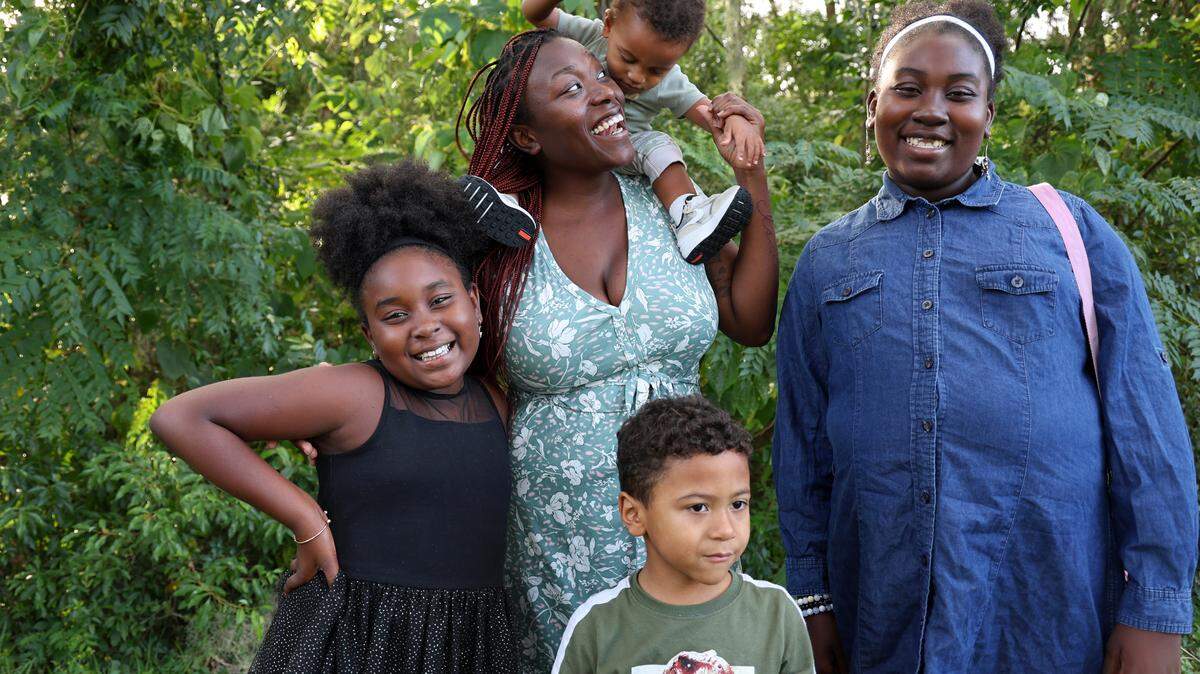 Jasmine Brown stands with her family, from left, Aijiah, Isaiah, Elijah, and Jaidah, in the backyard of their home in Marion County, Fla., Thursday, Oct. 5, 2023.