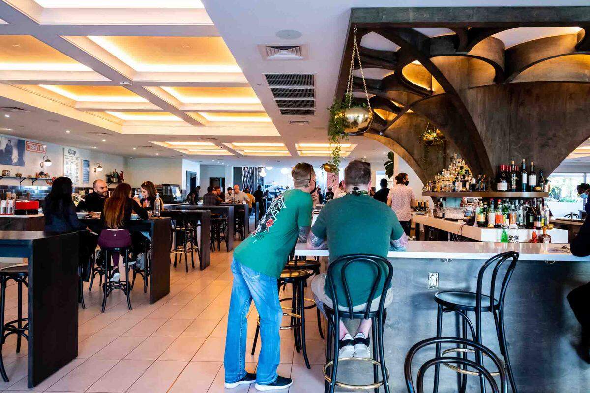 Customers can eat at The Bar at Mia Market in the Design District.