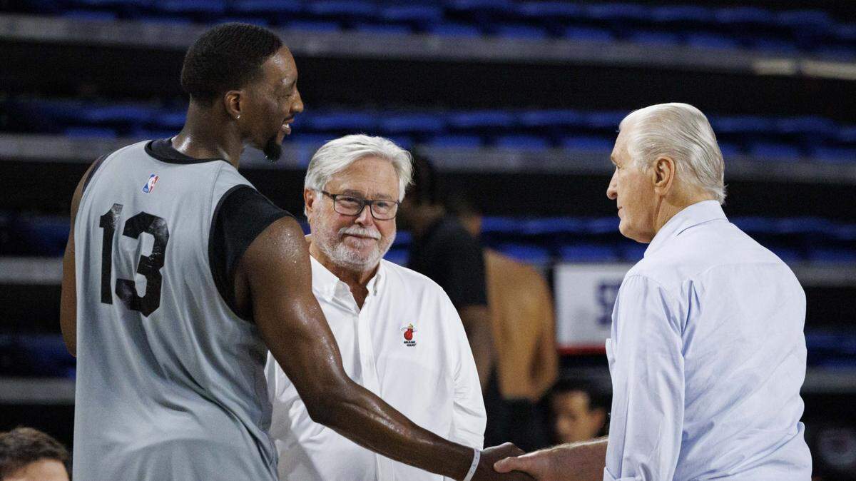 Bam Adebayo (13) shakes hands with Pat Riley, president of the Miami Heat, right, during the second day of Heat Training Camp on Oct. 1, 2025, at Florida Atlantic University in Boca Raton.