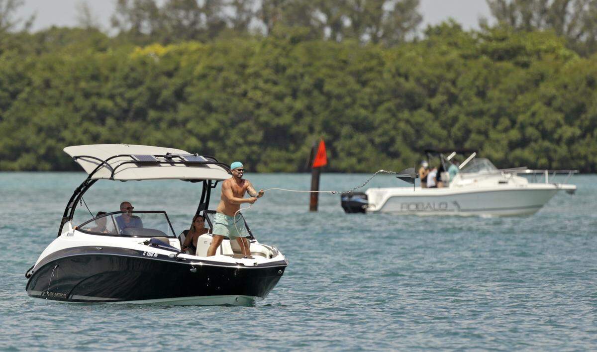 Recreational boaters sailing at the Haulover Sandbar as the Novel Coronavirus pandemic continues on Wednesday, April 29, 2020 in Miami Beach. Miami-Dade reopens parks, marinas and golf courses and imposes new COVID-19 rules.