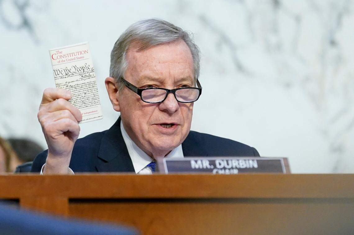 Sen. Dick Durbin, D-Ill., chairman of the Senate Judiciary Committee, holds a copy of the Constitution of the United States as he questions Supreme Court nominee Ketanji Brown Jackson during her Senate Judiciary Committee confirmation hearing on Capitol Hill in Washington, Wednesday, March 23, 2022. 