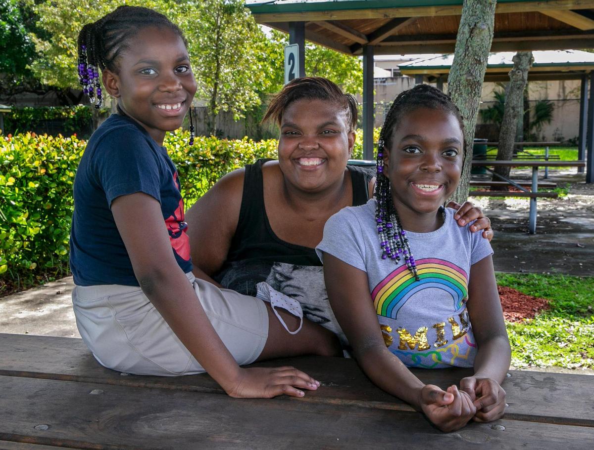 Cindy Lindor with her daughters Johichelie Francois, 8, left, and Anyhia Lindor 9, in Little Haiti. 