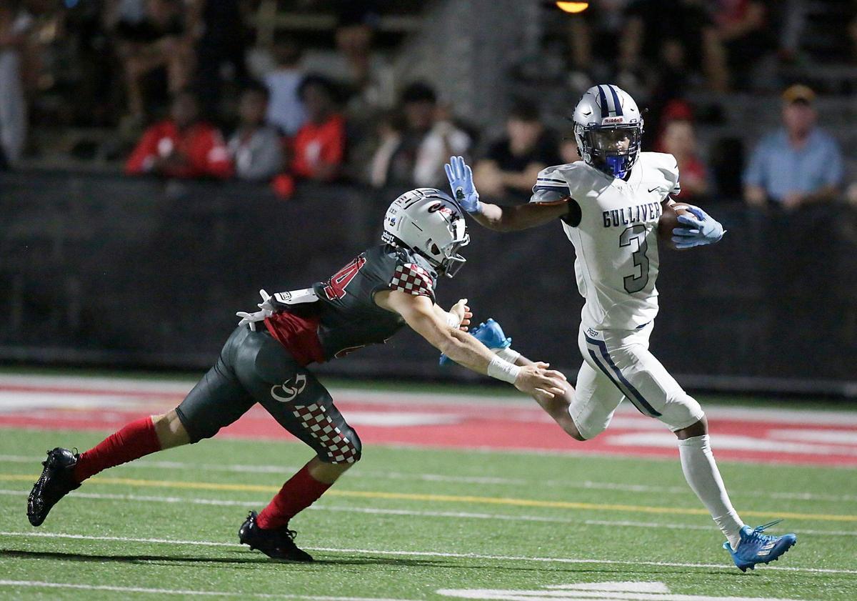 Gulliver Raiders wide receiver Jalen Brown (3) tries to escape with the ball during football game against Cardinal Gibbons Chiefs on Friday, September 9, 2022 at Cardinal Gibbons HS in Fort Lauderdale. Andrew Uloza / for Miami Herald