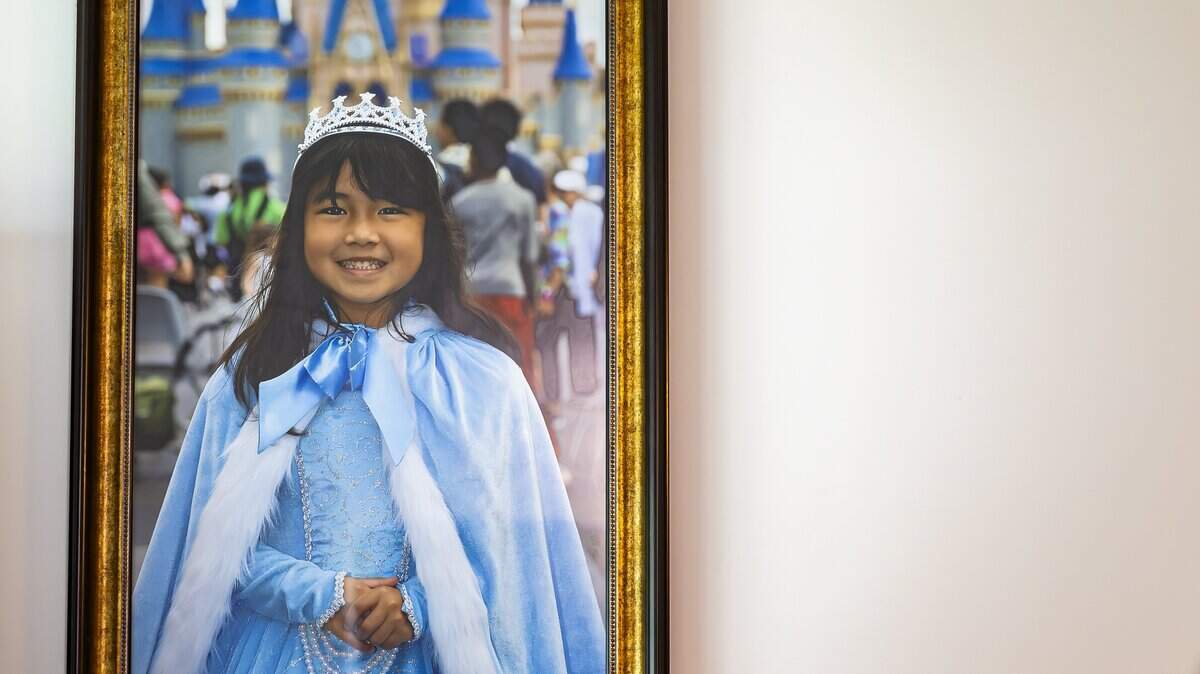 A photograph of Harlow Jet Tran, 6, hangs in the living room of her parents, Danny Tran and Samari Curbelo, on Wednesday, June 3, 2026, at their home in Coral Springs, Fla. Harlow was killed during a Coral Springs Police Department chase on May 5, 2024, and the family has filed a wrongful-death lawsuit against the city.