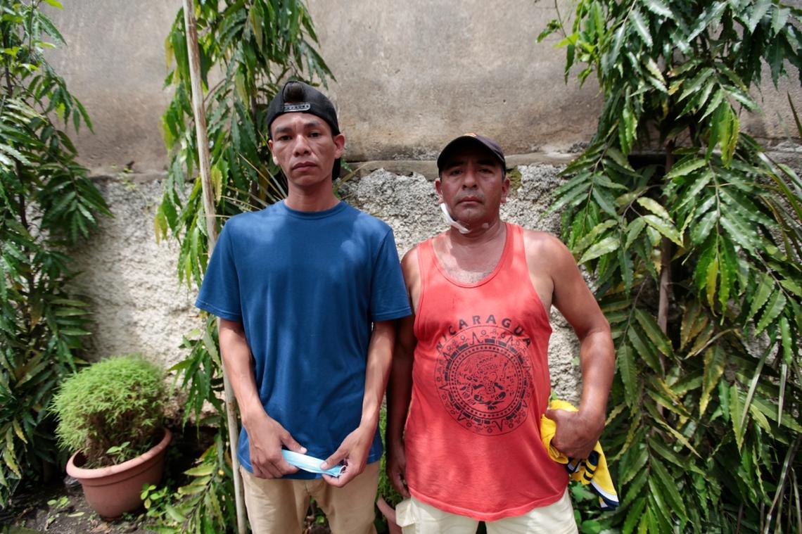 Alberto Armijo, right, visits the makeshift medical clinic at a parish house in Masaya, Nicaragua, along with his neighbor on June 6, 2018.