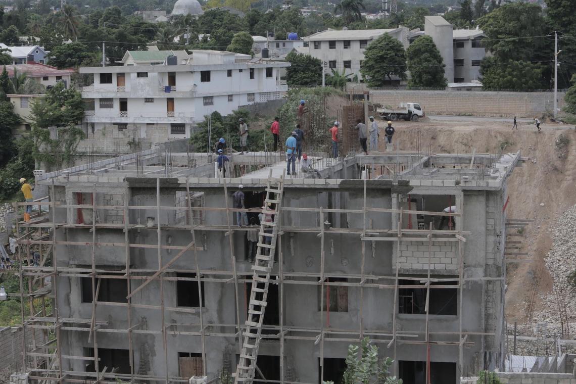 The Haitian government recommends that builders follow earthquake-resistant standards. But because Parliament has not voted on a national building code, there is no way to enforce it in construction, like at this apartment building going up in Port-au-Prince.