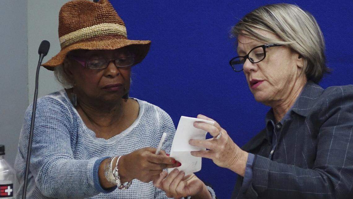 Broward Supervisor of Elections Brenda Snipes, left, and Broward County Judge Betsy Benson of the election canvassing board, listen to arguments, Sunday, Nov. 11, 2018, at the Broward Supervisor of Elections office in Lauderhill.