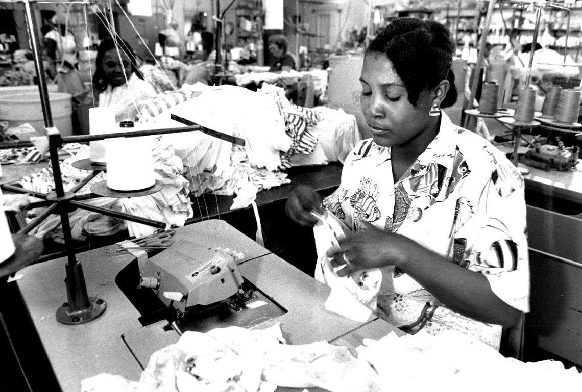 Claurene Philippe works on a outfit at the Holiday Sportswear factory in the Miami Fashion District.