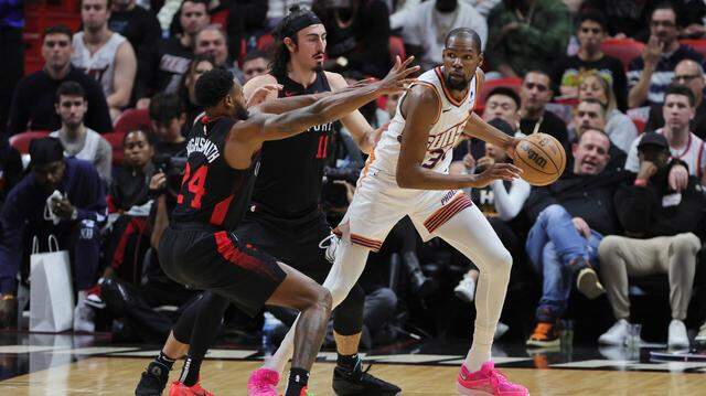 Phoenix Suns forward Kevin Durant (35) protects the basketball from Miami Heat forward Haywood Highsmith (24) and guard Jaime Jaquez Jr. (11) during the third quarter at Kaseya Center.