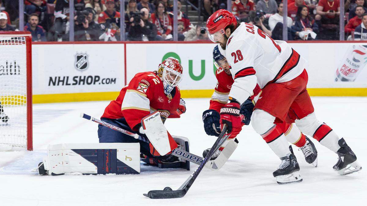 Florida Panthers goaltender Sergei Bobrovsky (72) and defenseman Seth Jones (3) defend as Carolina Hurricanes left wing William Carrier (28) tries to score in the first period of Game 4 during the Eastern Conference final of the NHL Stanley Cup playoffs at Amerant Bank Arena on Monday, May 26, 2025, in Sunrise, Fla.