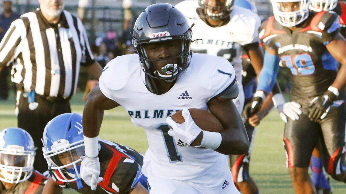 Palmetto Panthers’ Brashard Smith (1) carries the ball against Hialeah Thoroughbreds during the football game on Thursday, Sept. 5, 2019 at Milander Park Stadium in Hialeah