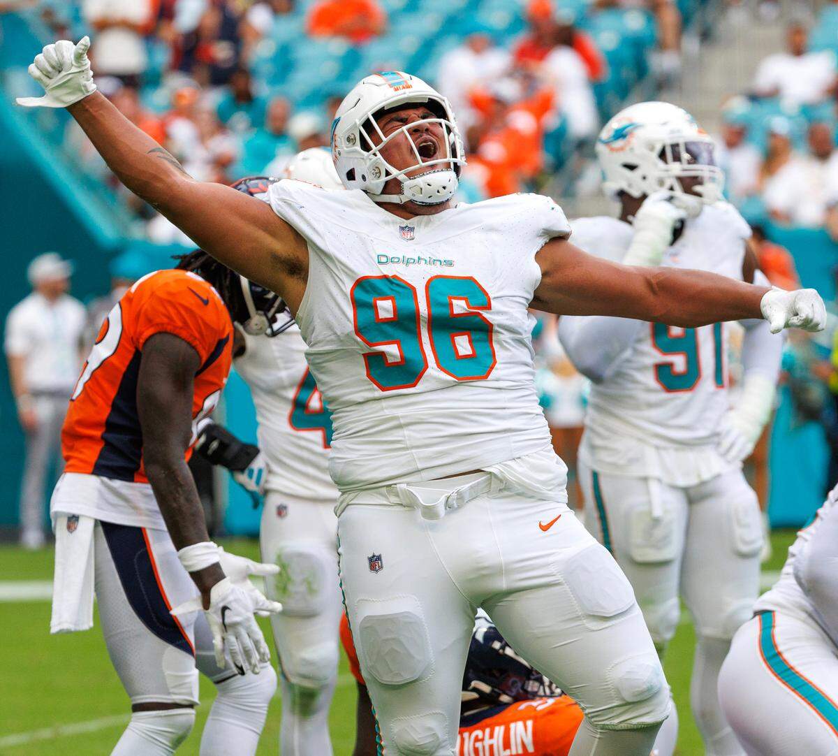Miami Dolphins defensive tackle Brandon Pili (96) reacts after a play against the Denver Broncos during fourth quarter of an NFL football game at Hard Rock Stadium on Sunday, Sept. 24, 2023 in Miami Gardens, Fl.