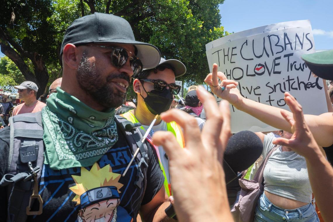 Enrique Tarrio, left, turned up at the ‘No Kings’ protest at the Torch of Friendship monument at Bayfront Park in Miami, Florida, on June 14, 2025. Some protesters extended the middle finger and shouted their disapproval at the former Proud Boys leader. Tarrio was pardoned by President Donald Trump for his role in the attack on the nation’s Capitol on Jan. 6, 2021.