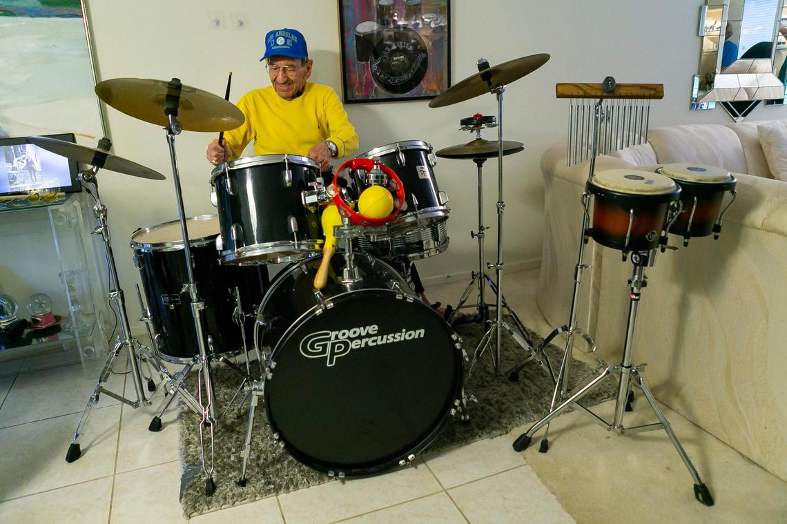 Holocaust survivor Saul Dreier, 95, plays the drums inside his home in Coconut Creek, Florida, on Tuesday, March 23, 2021. Dreier, a founding member of the Holocaust Survivor Klezmer Band, received a basket with a kosher Seder meal from the Goodman Jewish Family Services of Broward County in preparation for the upcoming Passover holiday.
