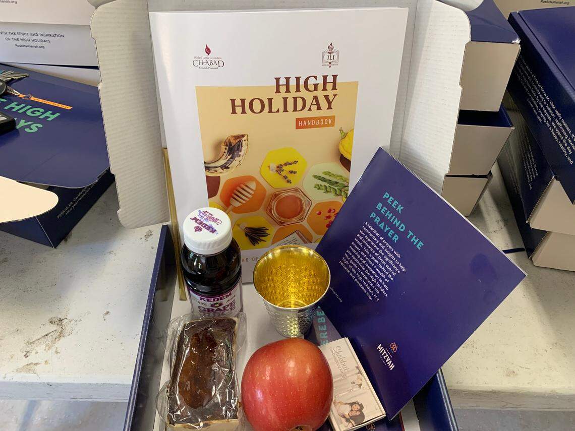 Volunteers planned to deliver “Do It Yourself” Rosh Hashana holiday packages to hundreds of families in Kendall, Pinecrest, South Miami on Sept. 17, 2020, put together by Rabbi Yossi Harlig from the Chabad of Kendall/Pinecrest. Many recipients are either elderly, alone, or are caring for a relative with special needs. The Rosh Hashana box contains wine, honey, cake, a wine cup and a step-by-step prayer book for individuals to worship at home.