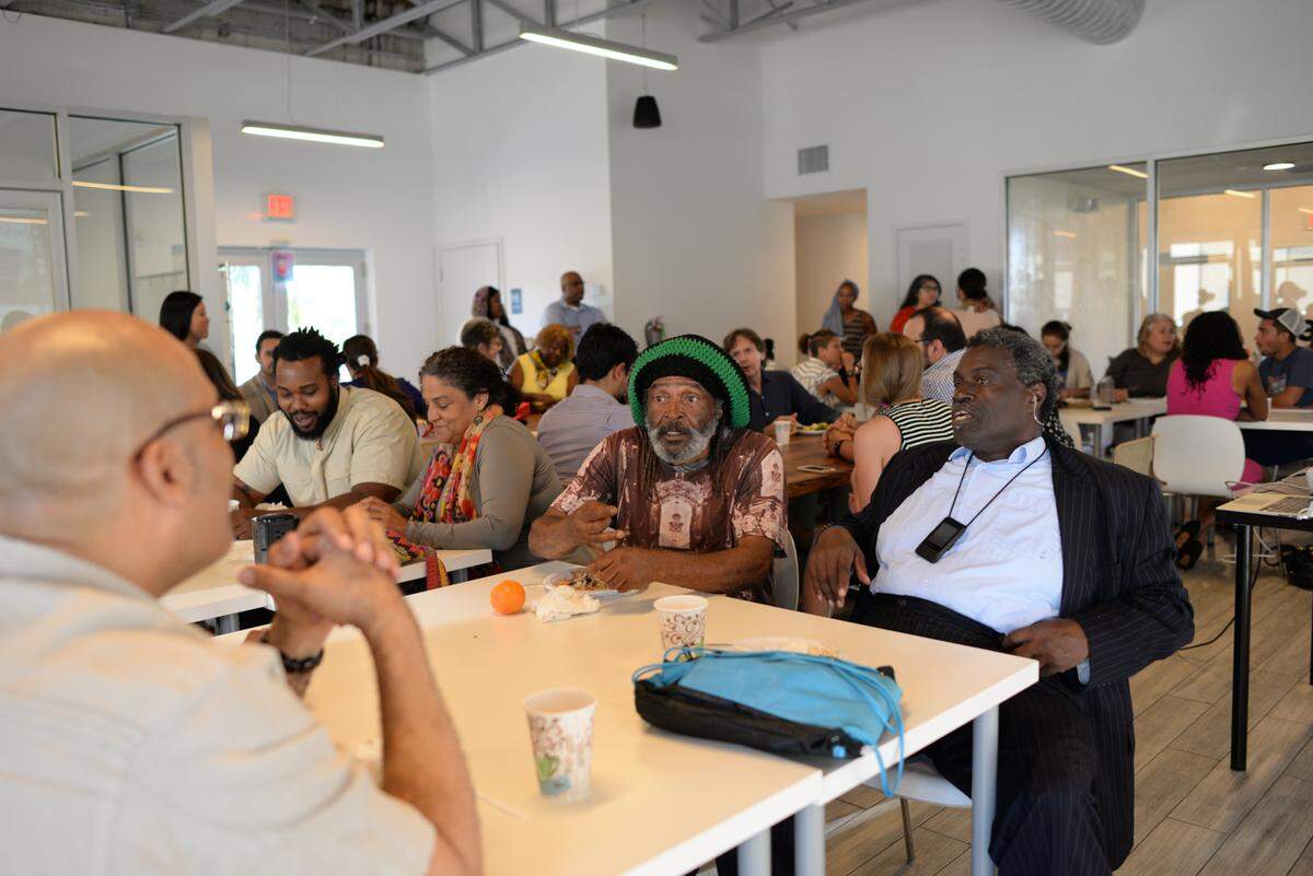 Michael Clarkson (middle) speaks with local residents about concerns.