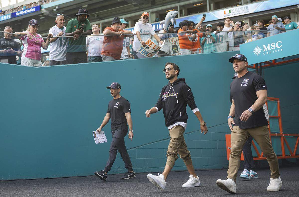 Miami Dolphins head coach Mike McDaniel makes his way on the field before his team's NFL game against the Los Angeles Chargers at Hard Rock Stadium on Sunday, Oct. 12, 2025, in Miami Gardens, Fla.