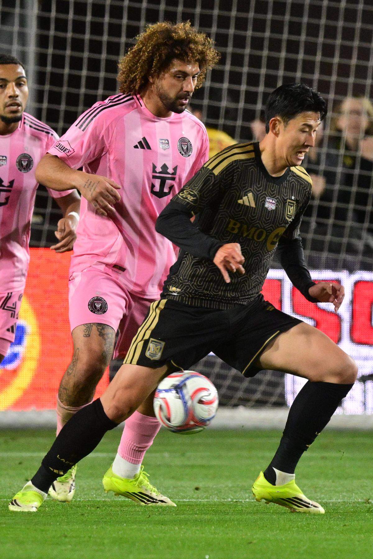 LAFC's South Korean forward #07 Son Heung-min (R) and Inter Miami's Uruguayan defender #37 Maximiliano Falcon fights for the ball during the Major League Soccer opening match between Los Angeles Football Club and Inter Miami CF at the LA Memorial Coliseum in Los Angeles, on February 21, 2026. (Photo by Frederic J. Brown / AFP via Getty Images)