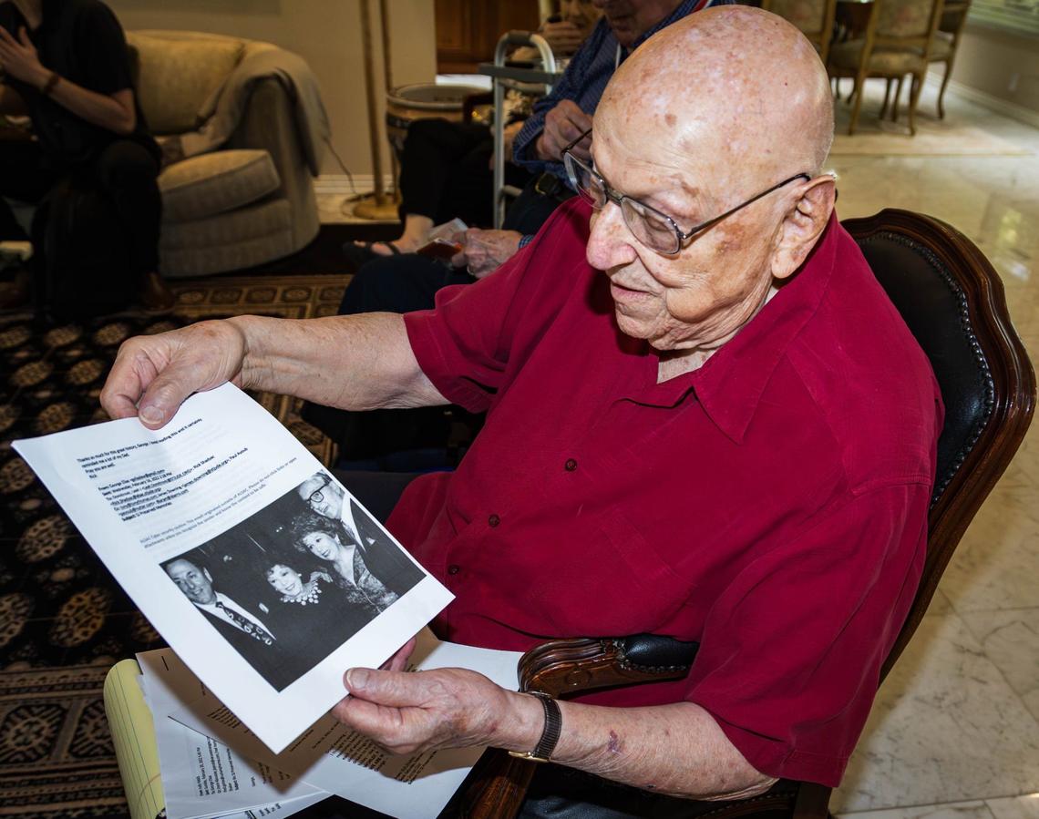 George Elias Jr. holds a photo of him with founder of St. Jude’s Children’s Research Hospital, Danny Thomas and their wives in the year 1991 on Saturday, August 3, 2024 in Coral Gables, Fla. Elias is the last living founding board member of the research hospital.