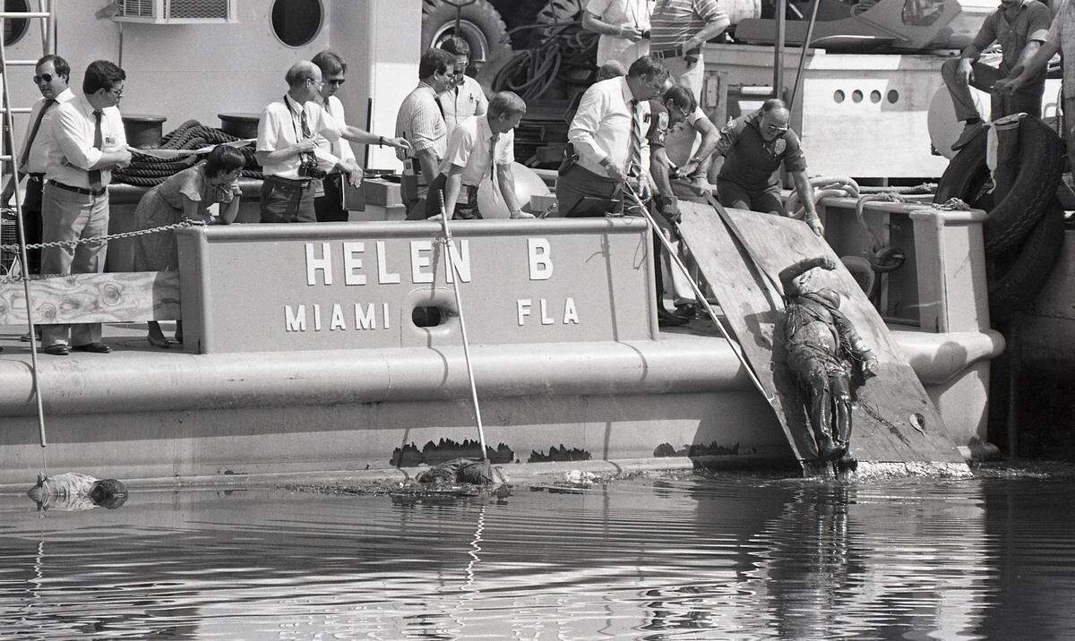 Three bodies of drug dealers being pulled from the Miami River after they were dumped by Miami police officers who were later convicted in the murders that shocked the country in 1985 at the height of the drug violence in South Florida.