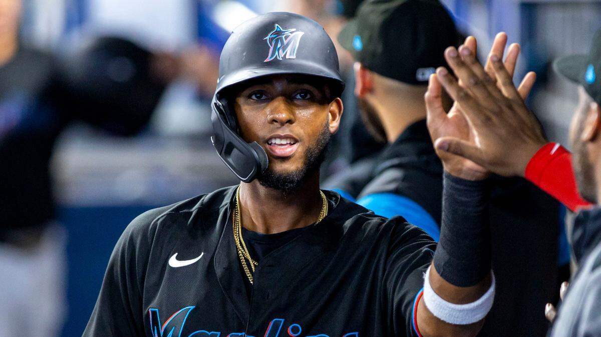 Miami Marlins base runner Lewin Diaz (34) reacts inside the dugout with his teammates after scoring during the first inning of an MLB game against the New York Mets at loanDepot park in the Little Havana neighborhood of Miami, Florida, on Friday, July 29, 2022.