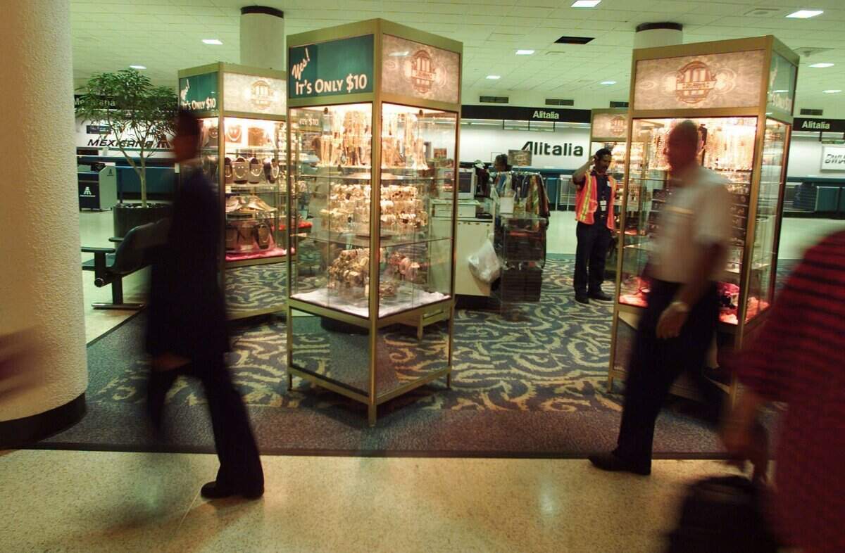 In 2001, boutiques with $10 watches, glasses, belts and even "designer scarves" along the concourse at Miami International Airport.
